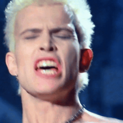 A Close Up Of A Man 'S Face With His Mouth Open And His Eyes Closed GIF