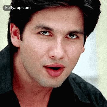 A Close Up Of A Man 'S Face With His Mouth Open And His Eyes Closed . GIF