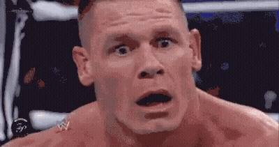 A Close Up Of A Man 'S Face With His Mouth Open And His Eyes Closed . GIF