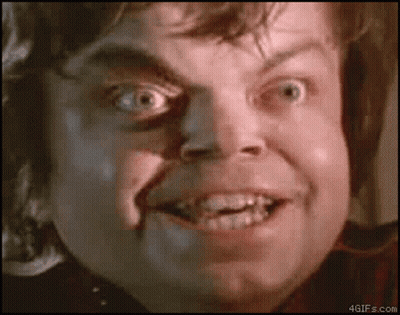 A Close Up Of A Man 'S Face With His Mouth Open And His Teeth Visible GIF