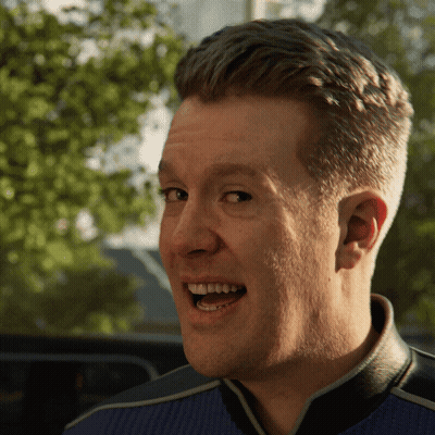 A Close Up Of A Man 'S Face With His Mouth Open And Trees In The Background GIF