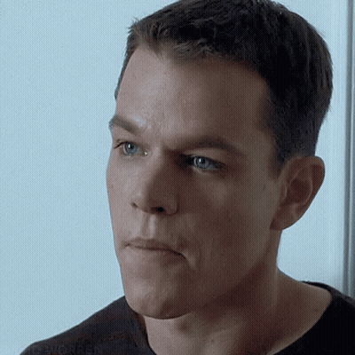 A Close Up Of A Man 'S Face With His Mouth Open GIF