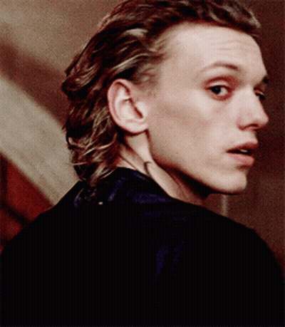 A Close Up Of A Man 'S Face With His Mouth Open GIF