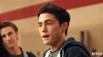 A Close Up Of A Man 'S Face With His Mouth Open In A Locker Room . GIF