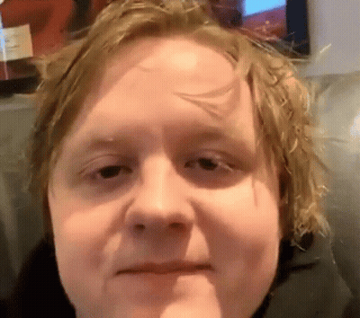 A Close Up Of A Man 'S Face With His Mouth Open GIF