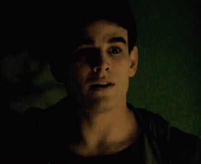 A Close Up Of A Man 'S Face With His Mouth Open GIF