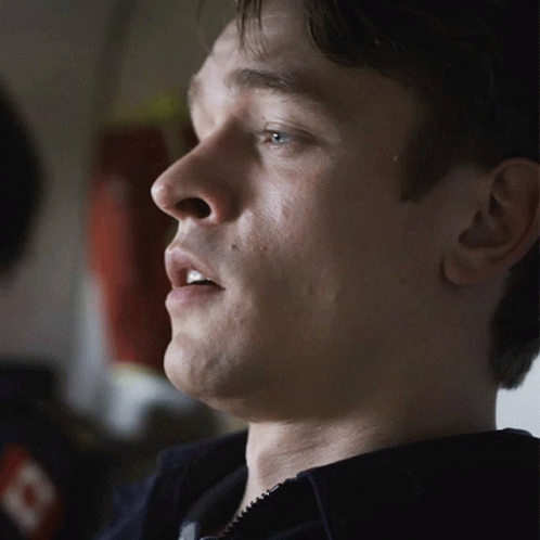 A Close Up Of A Man 'S Face With His Mouth Open GIF