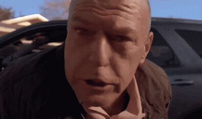A Close Up Of A Man 'S Face With His Mouth Open GIF