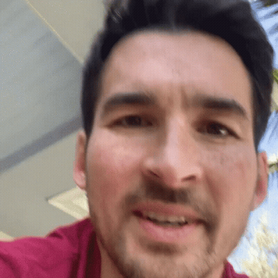 A Close Up Of A Man 'S Face With His Mouth Open GIF