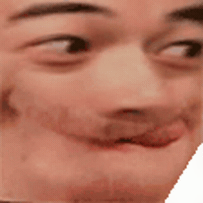 A Close Up Of A Man 'S Face With His Tongue Out And A Smile On His Face . GIF