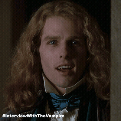 A Close Up Of A Man 'S Face With #Interviewwiththevampire Written Below Him GIF