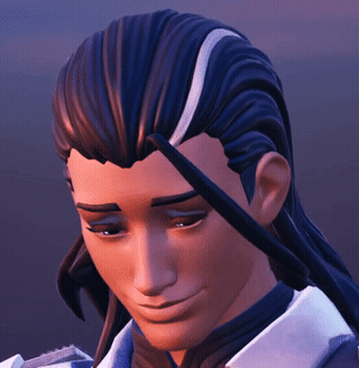 A Close Up Of A Man 'S Face With Long Hair And A Smile On His Face GIF