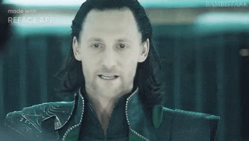 A Close Up Of A Man 'S Face With Long Hair And A Smile . GIF