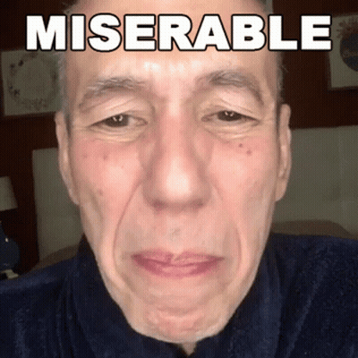 A Close Up Of A Man 'S Face With Miserable Written On His Face GIF