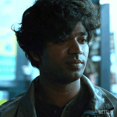 A Close Up Of A Man 'S Face With Netflix Written On His Jacket GIF