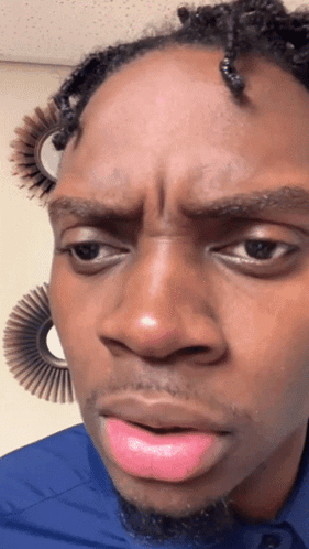 A Close Up Of A Man 'S Face With Pink Lipstick GIF