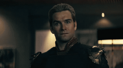 A Close Up Of A Man 'S Face With Red Eyes Looking At The Camera GIF