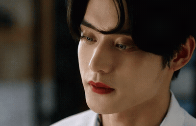 A Close Up Of A Man 'S Face With Red Lips GIF