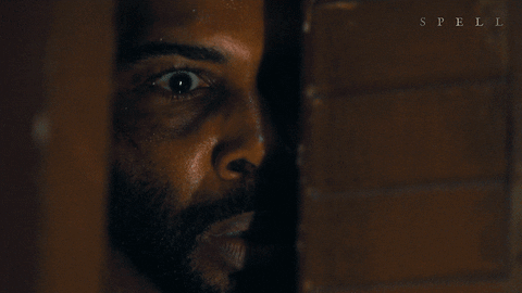 A Close Up Of A Man 'S Face With Spell Written Below Him GIF