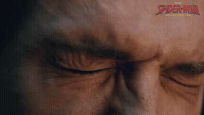 A Close Up Of A Man 'S Face With Spider-Man Written On The Bottom GIF