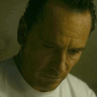 A Close Up Of A Man 'S Face With Sweat Coming Off His Forehead GIF