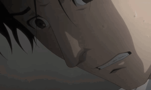 A Close Up Of A Man 'S Face With Sweat Coming Out Of His Mouth GIF