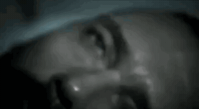 A Close Up Of A Man 'S Face With Sweat Coming Out Of It . GIF