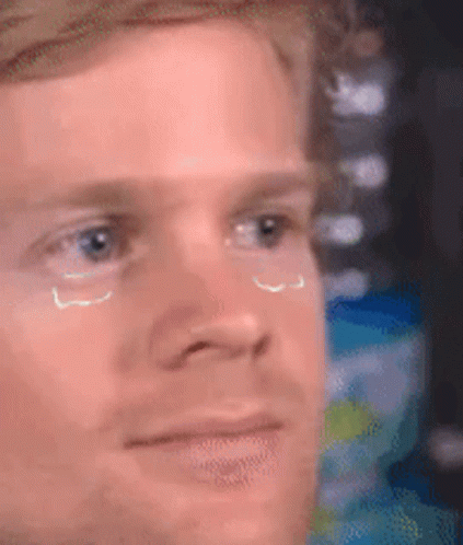 A Close Up Of A Man 'S Face With Tears Coming Down His Eyes . GIF