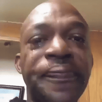 A Close Up Of A Man 'S Face With Tears Running Down His Face . GIF