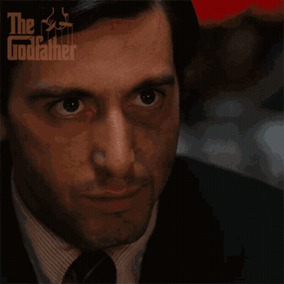 A Close Up Of A Man 'S Face With The Godfather Logo On The Bottom GIF