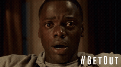 A Close Up Of A Man 'S Face With The Hashtag #Getout On The Bottom GIF