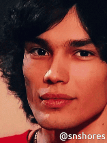 A Close Up Of A Man 'S Face With The Hashtag @Snshores On The Bottom GIF
