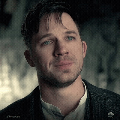 A Close Up Of A Man 'S Face With The Hashtag Timeless GIF