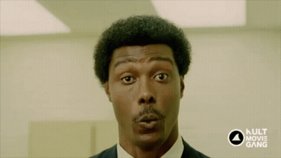 A Close Up Of A Man 'S Face With The Kult Movie Gang Logo In The Corner GIF