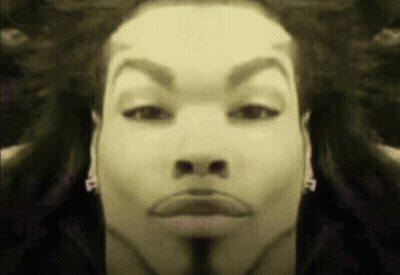 A Close Up Of A Man 'S Face With The Letter P On His Earring GIF