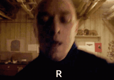A Close Up Of A Man 'S Face With The Letter R Visible GIF
