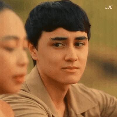 A Close Up Of A Man 'S Face With The Letters Lje On The Bottom Right GIF