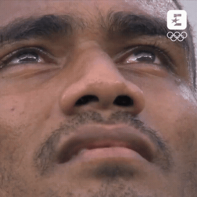 A Close Up Of A Man 'S Face With The Letters Lm On The Bottom Right GIF