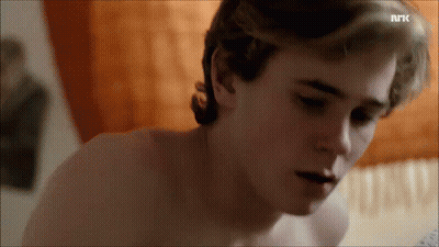 A Close Up Of A Man 'S Face With The Letters Nrk On The Bottom Left GIF