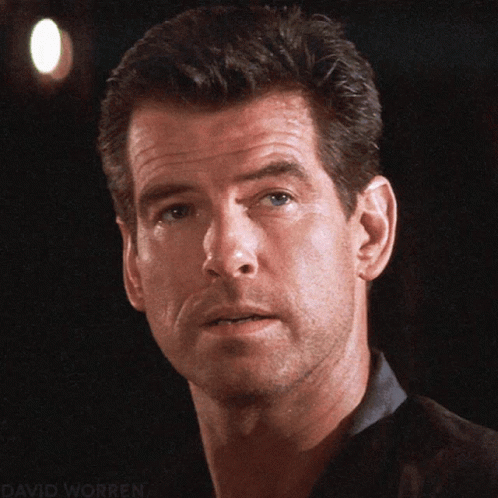 A Close Up Of A Man 'S Face With The Name David Worren Visible GIF