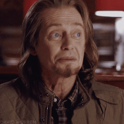 A Close Up Of A Man 'S Face With The Name David Worren Visible GIF