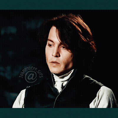 A Close Up Of A Man 'S Face With The Name Johnny Depp At The Bottom Of The Image GIF
