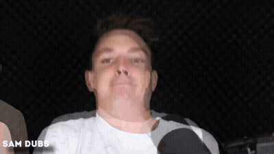 A Close Up Of A Man 'S Face With The Name Sam Dubs Written Below It GIF