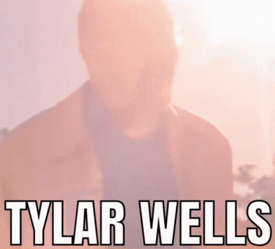 A Close Up Of A Man 'S Face With The Name Tylar Wells Written Above Him GIF