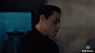 A Close Up Of A Man 'S Face With The Regal Logo In The Corner GIF