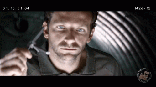 A Close Up Of A Man 'S Face With The Time Displayed As 14:26 GIF