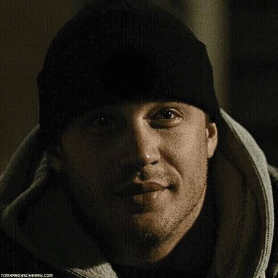 A Close Up Of A Man 'S Face With The Website Tomhardyscherry.com On The Bottom Right GIF