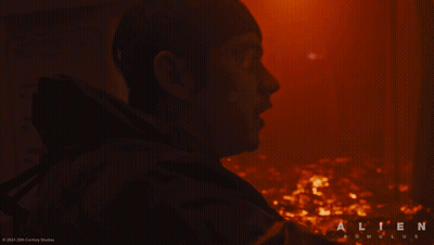 A Close Up Of A Man 'S Face With The Word Alien On The Bottom Right GIF