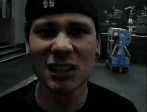 A Close Up Of A Man 'S Face With The Word Amsterdam On The Bottom GIF