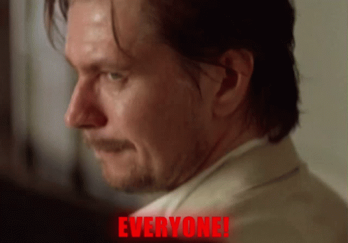 A Close Up Of A Man 'S Face With The Word Everyone Written In Red GIF